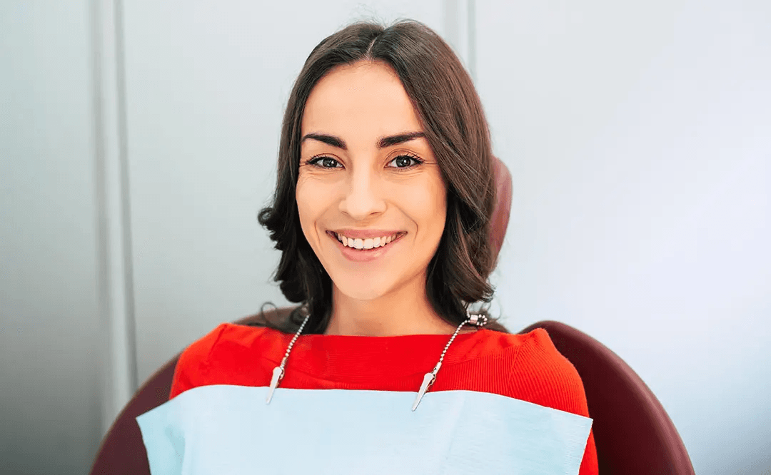 Smiling patient ready for a dental exam and cleaning