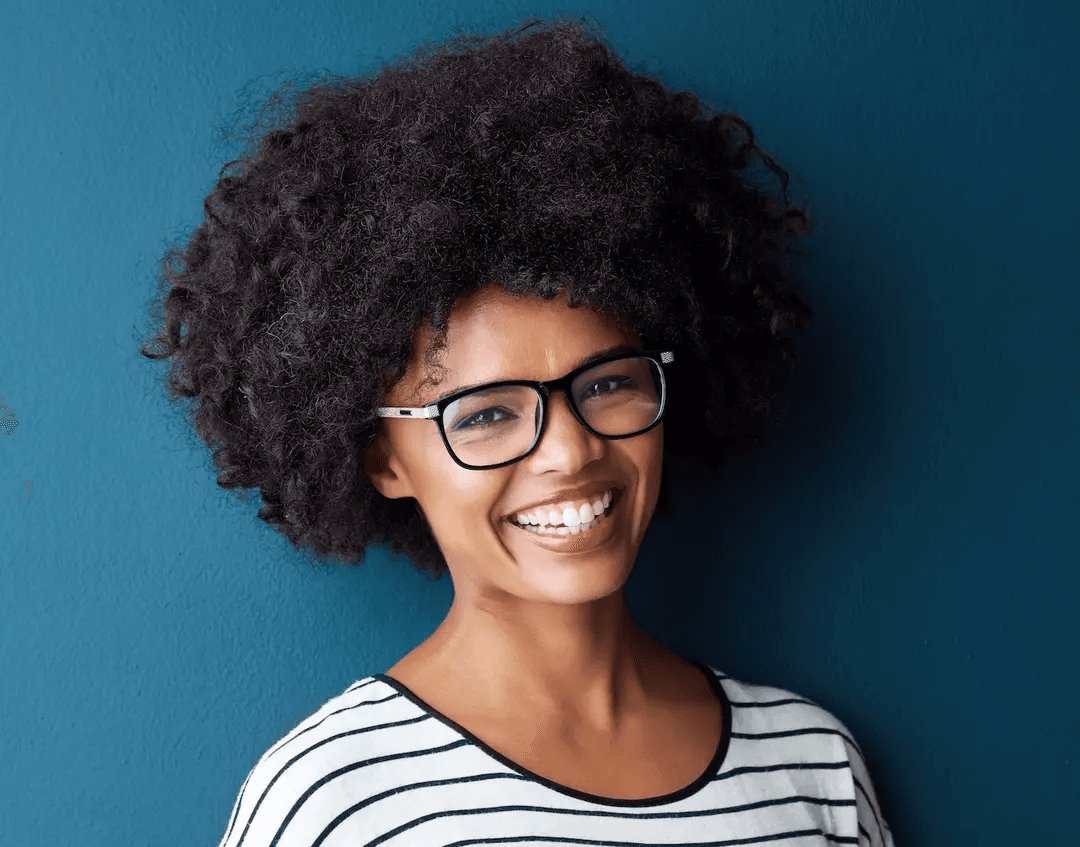 Smiling woman with a bright, white smile after professional teeth whitening